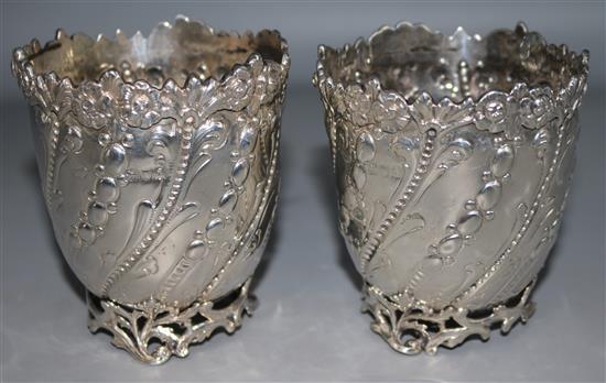 A pair of late Victorian repousse silver vases by Goldsmiths & Silversmiths Co. Ltd, London, 1899, 3.75in.